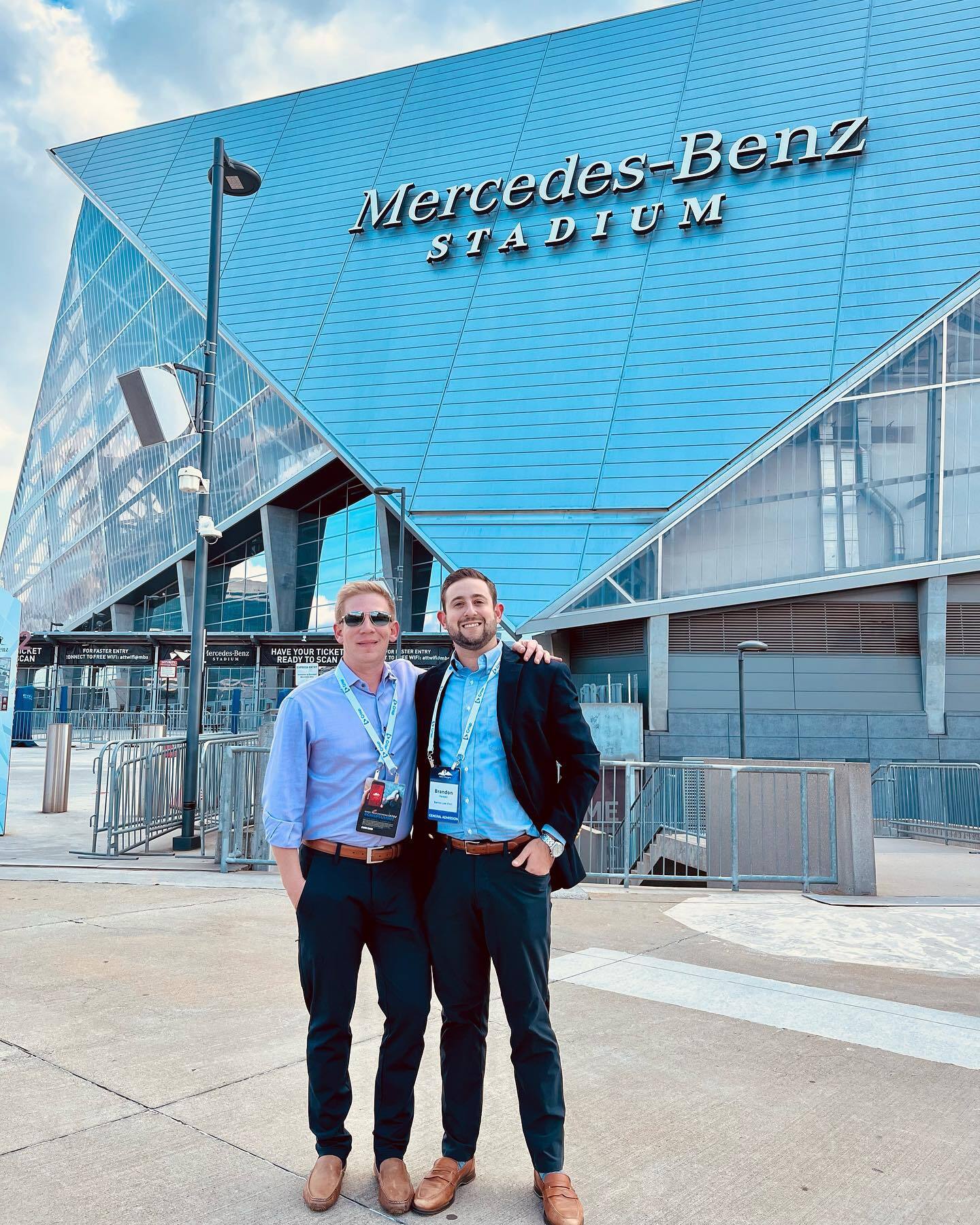 Attorney John Barnes and Attorney Brandon D. Fersten standing outside in front of Mercedes-Benz Stadium