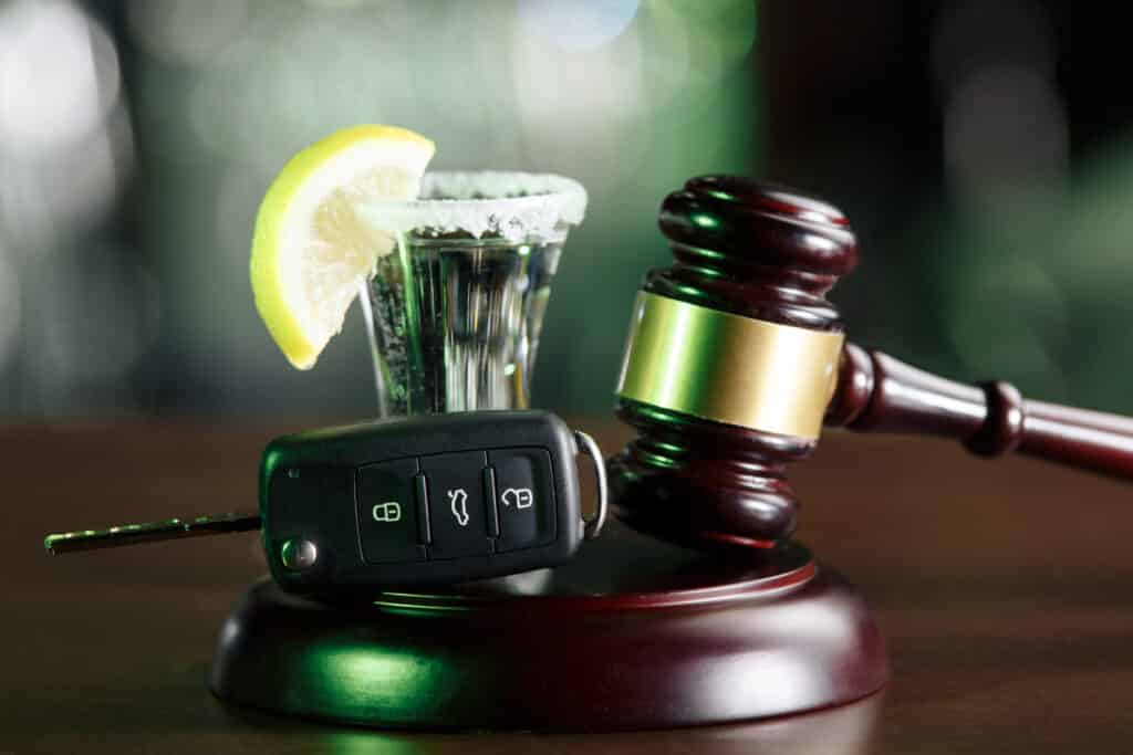 Gavel, car keys, and a shot of tequila